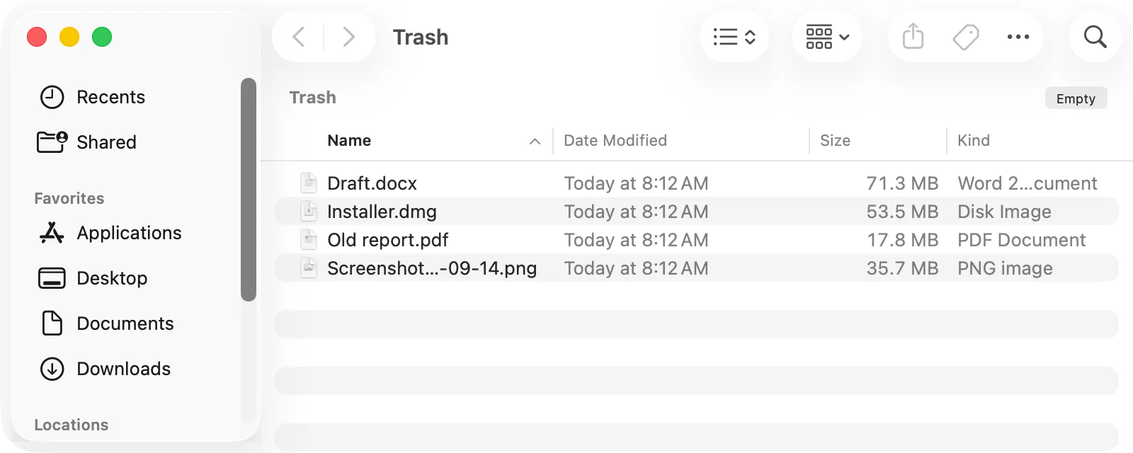 The Trash window in Finder with the Empty button